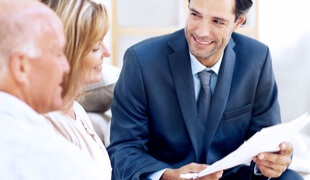 Attorney discussing options with older couple