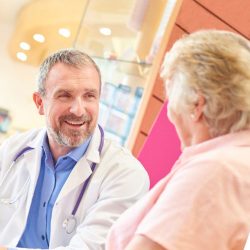 Doctor speaking with an older woman