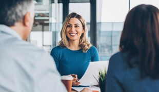 Woman going over financial options with an older couple