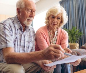 Older couple reviewing medical records