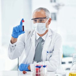 Doctor analyzing a vial of blood