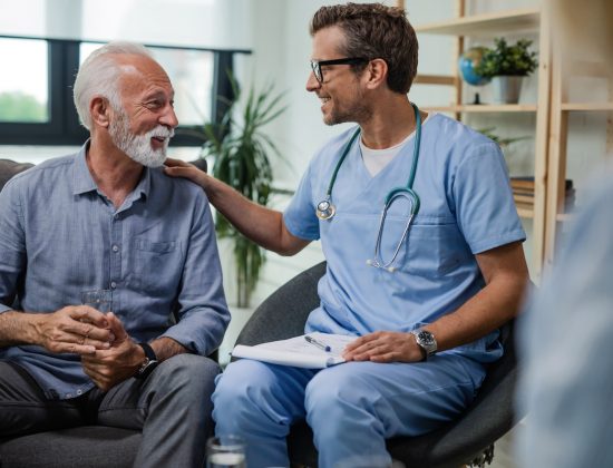 Older man talking with a cancer specialist