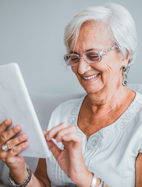 Senior woman reviewing medical information on a tablet device