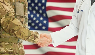 doctor and veteran shaking hands