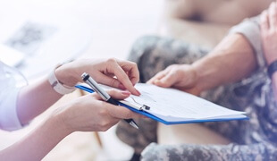 Veteran being helped with paperwork